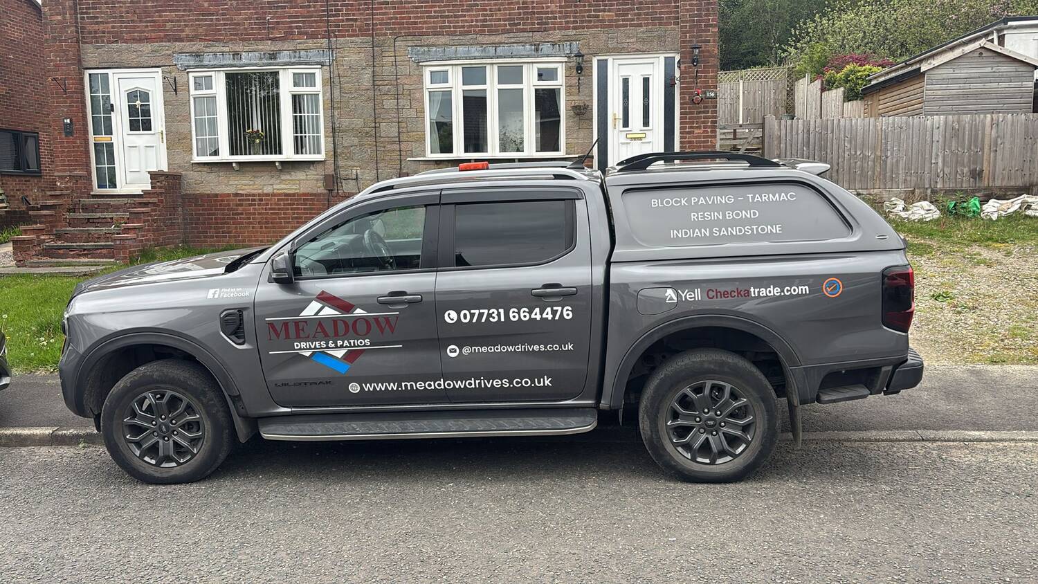 The Meadow Drives and Patios branded Ford Ranger pickup parked on a Burnley street